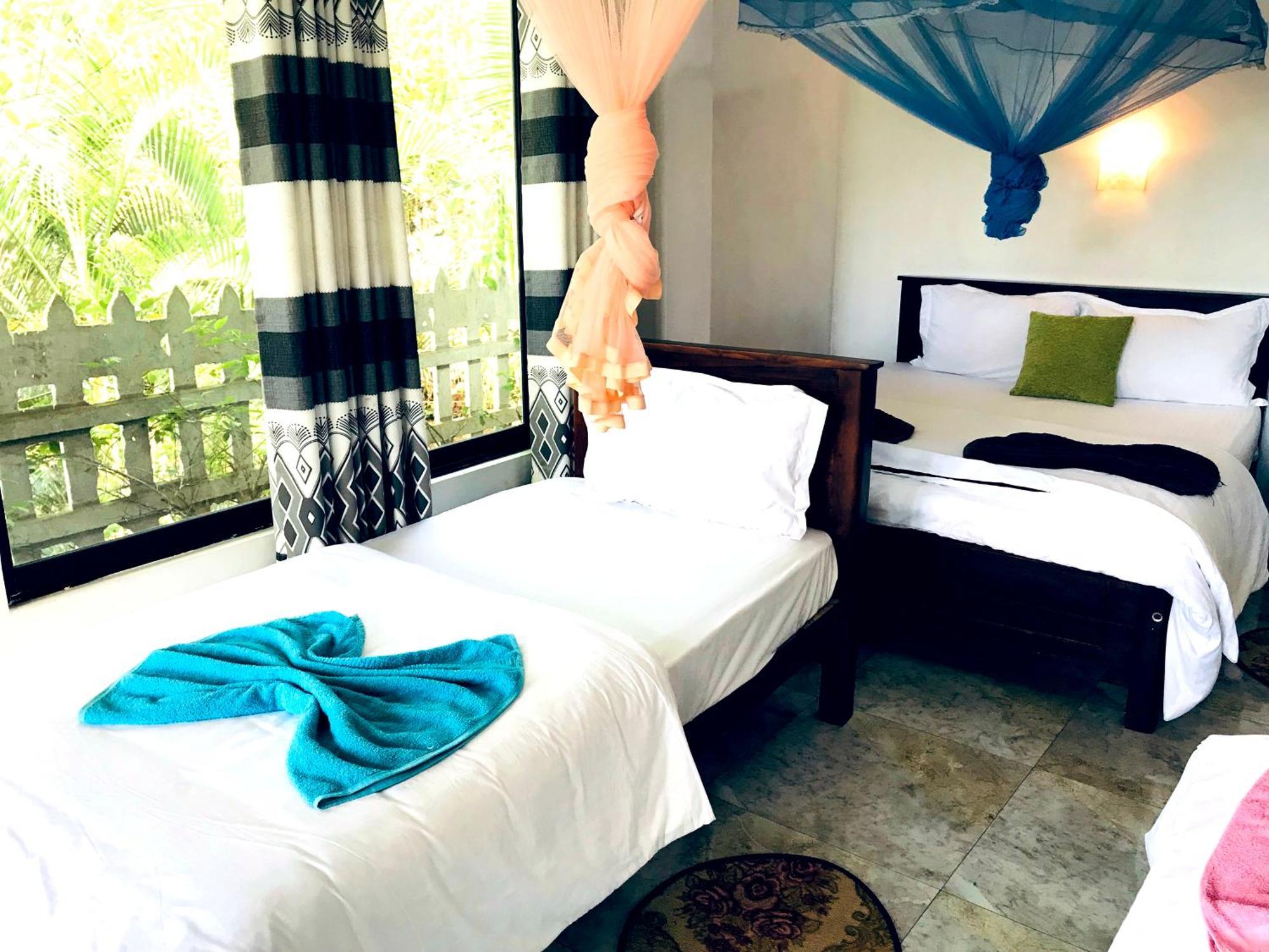 9 Arch View Rest Inn Ella Bagian luar foto